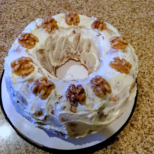 Frosted bundt cake with walnuts